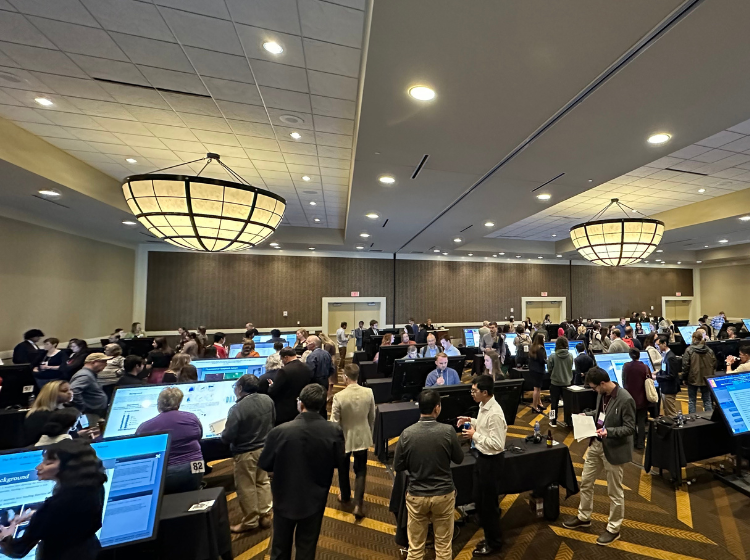 A shot of the crowd in the conference room during a poster session at the K-INBRE Symposium. 