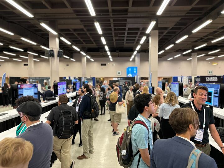 A crowd of presenters and attendees during one of the poster sessions at the AAS 242 Meeting. 