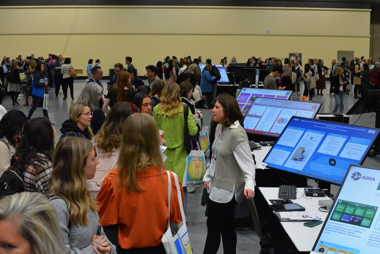 Crowd's of attendees interactiing with author/presenters at ASHA ELEVATE Convention 2024