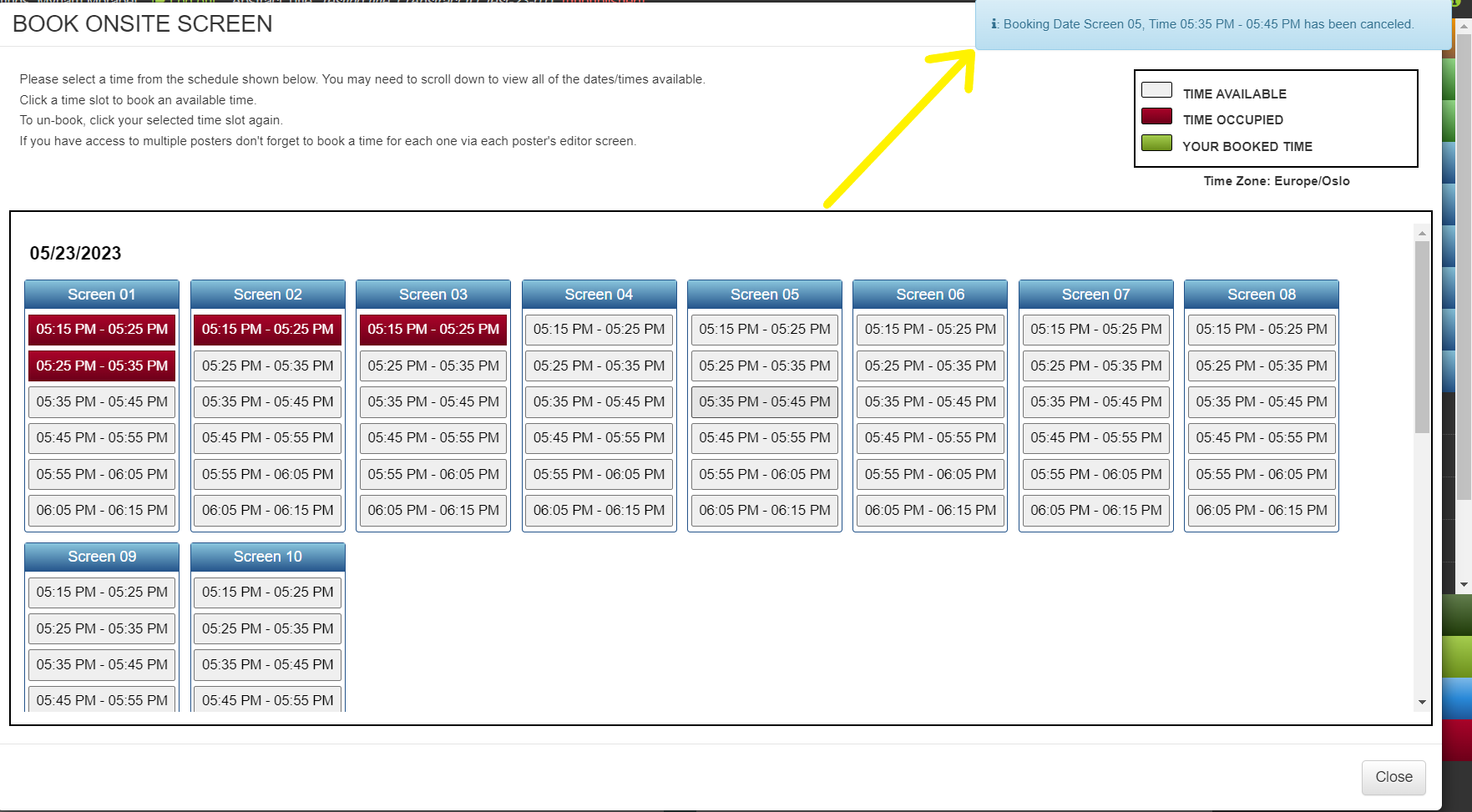 The 'Book Schedule time' screen. There is a yellow arrow pointing to a pop up notification advising that the selected time has been un-booked. 